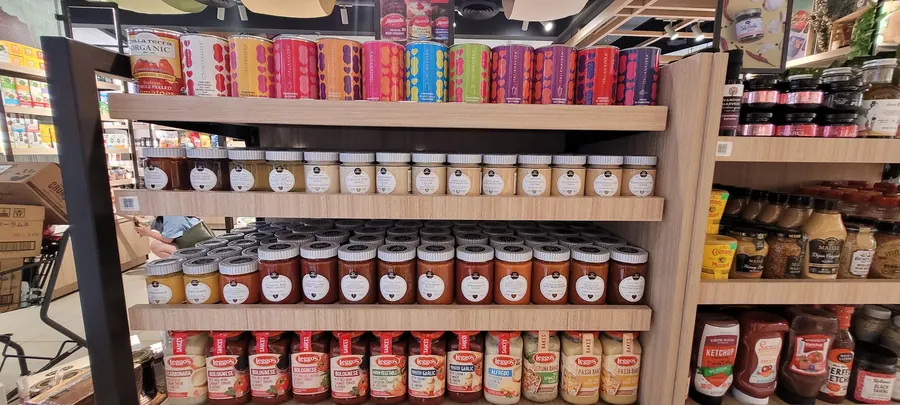 Italianavera tomatoes above a full range of Italian pasta sauces and gourmet creams.