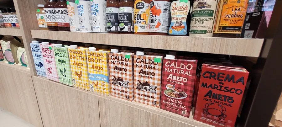 Aneto 100% natural Spanish broths and caldos merchandised as a full-facing block.
