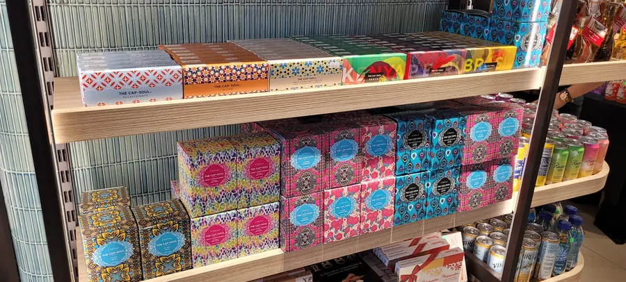 The Cap-Soul single-origin coffee capsules and tea gift boxes in a dedicated display bay.