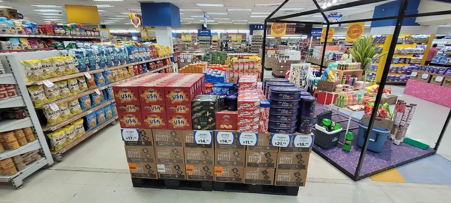 Full pallet feature of Jacob's biscuit selections and Elite tins in a high-traffic retail aisle.